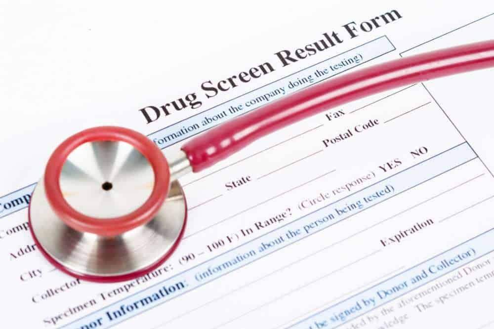 drug screen results form with stethescope